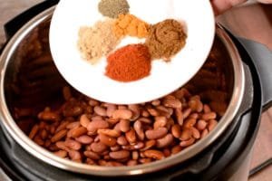 Adding Spices to the Red Beans
