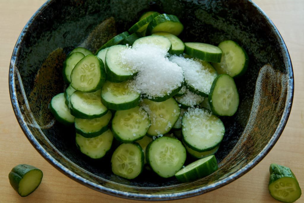 Sliced cucumber with salt in a bowl 