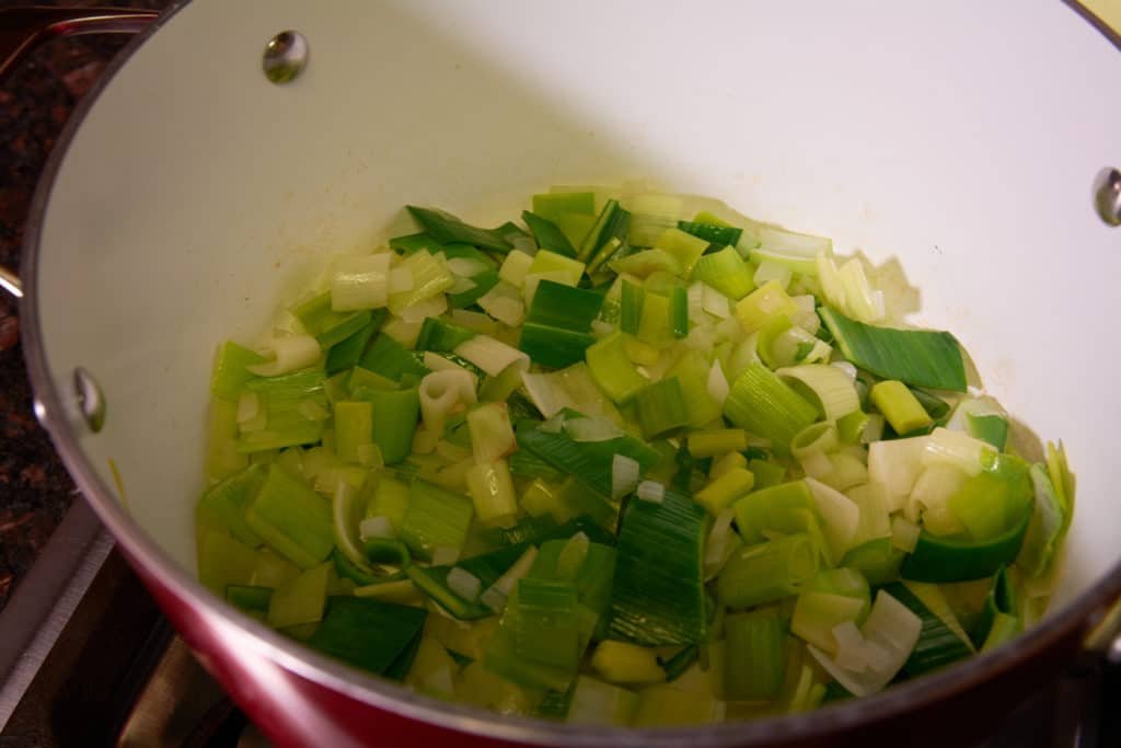 Pot with cut up leeks being cooked