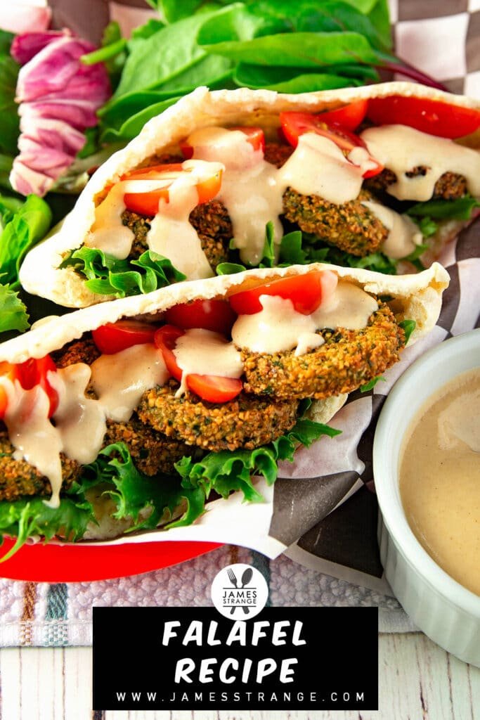 Falafel sandwich in a basket with sauce on the side. this is for pinning to Pinterest