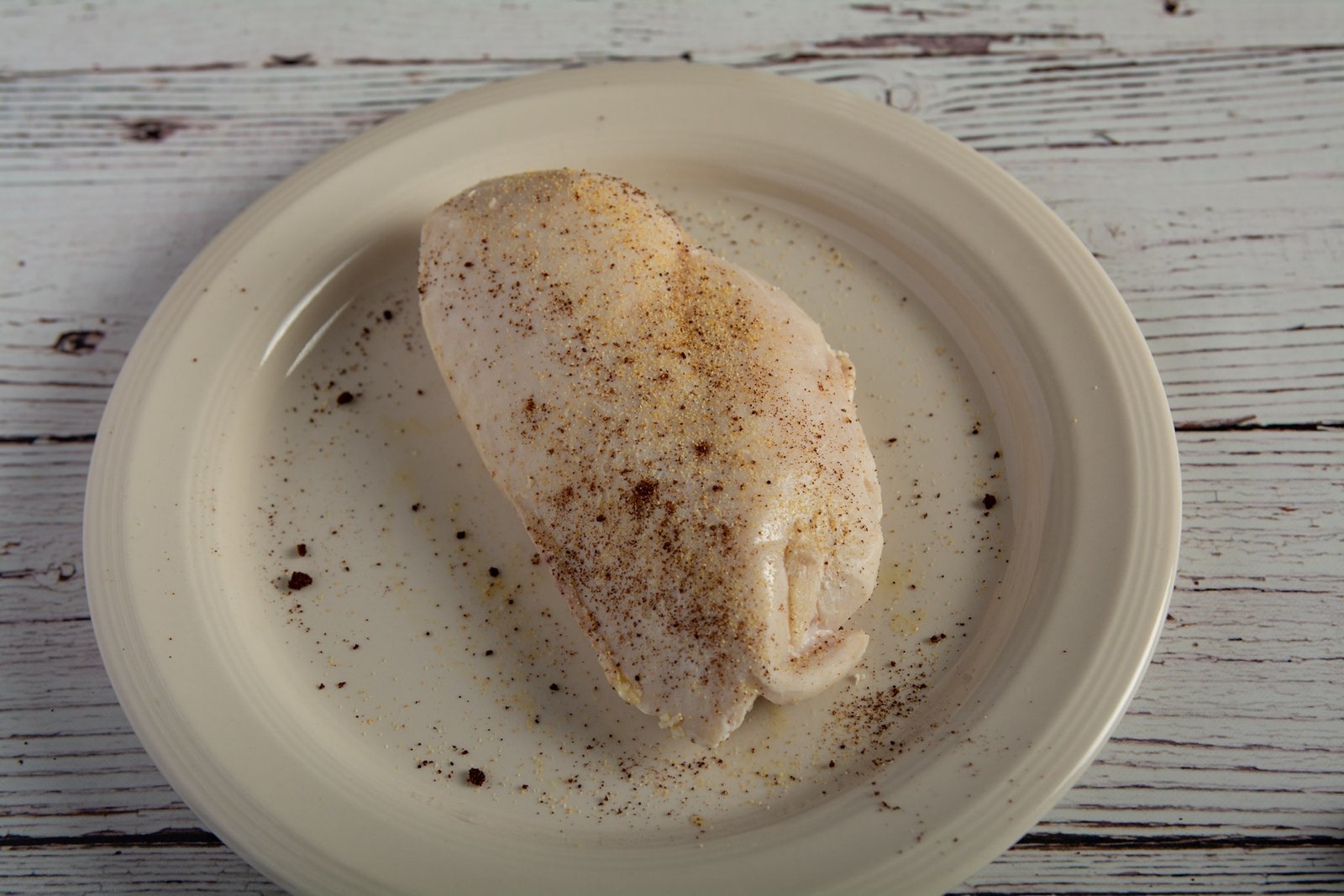 Seasoned chicken breast on a plate