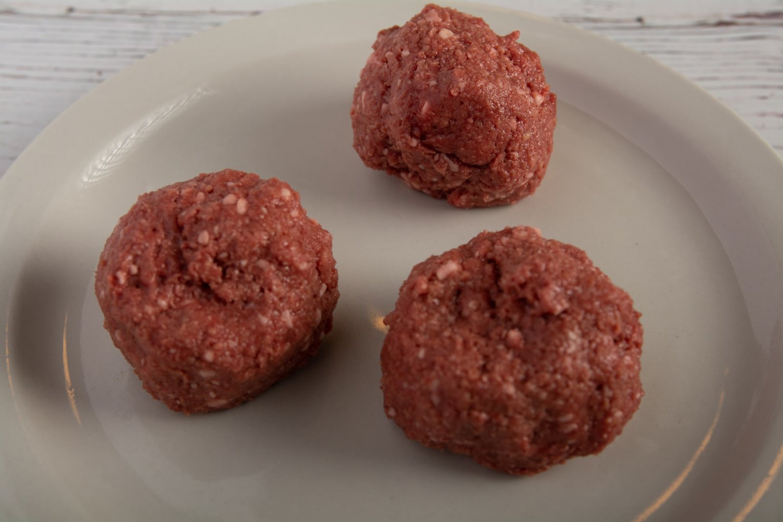 Three balls of vegan meat on a plate