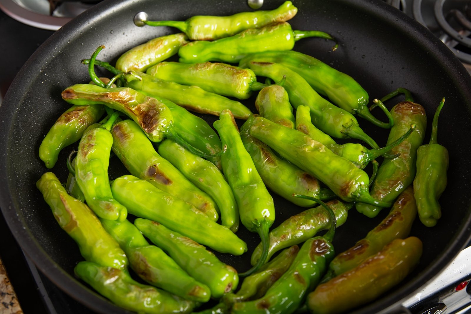 Peppers frying in a pan