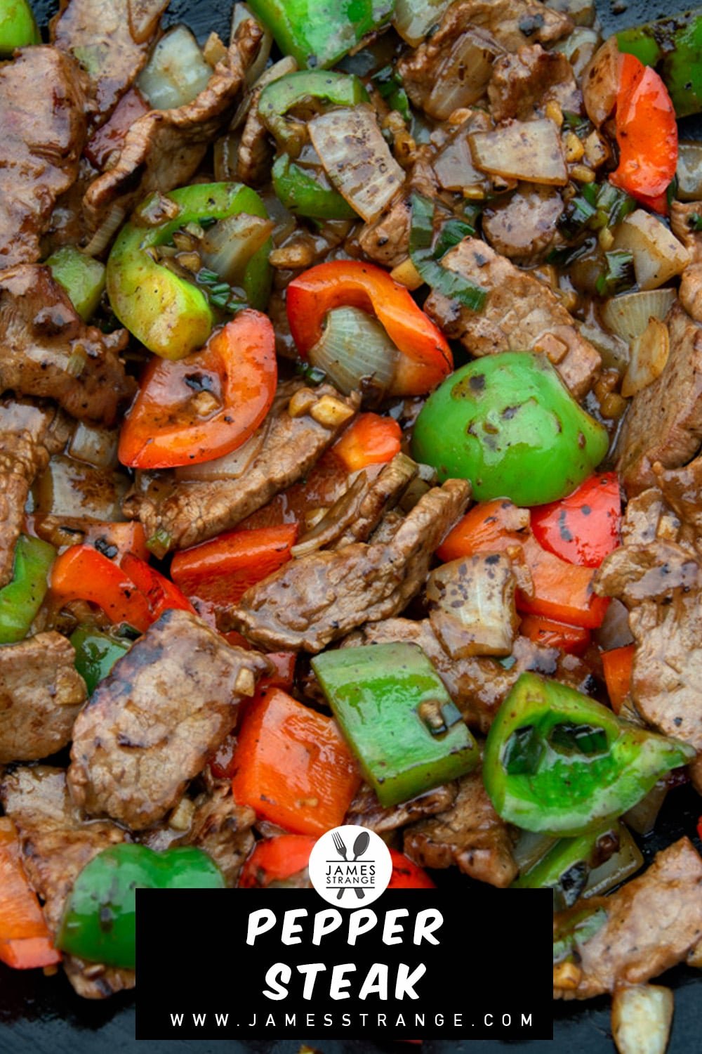 Closeup of stirips of steak stirfried with bell peppers and onion. This is a pin for Pinterest.