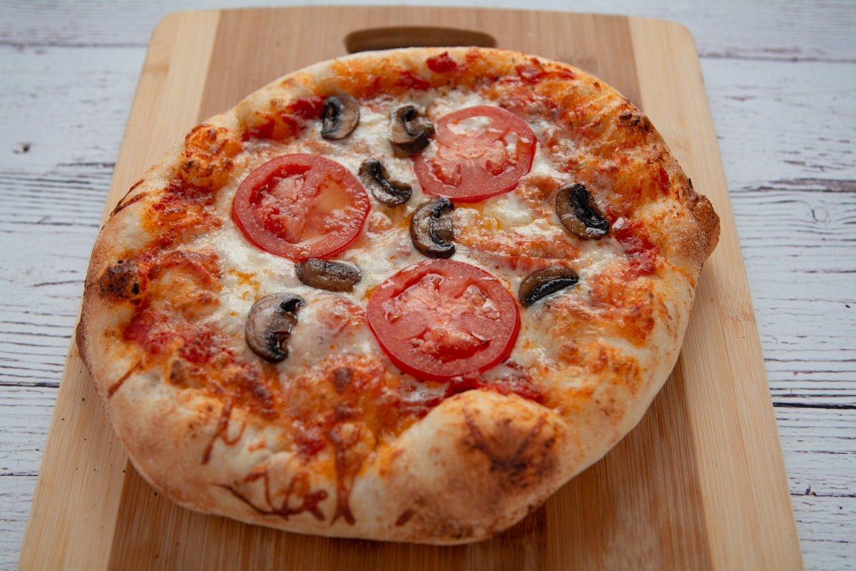 Tomato, cheese and mushroom pizza fresh out of the oven.