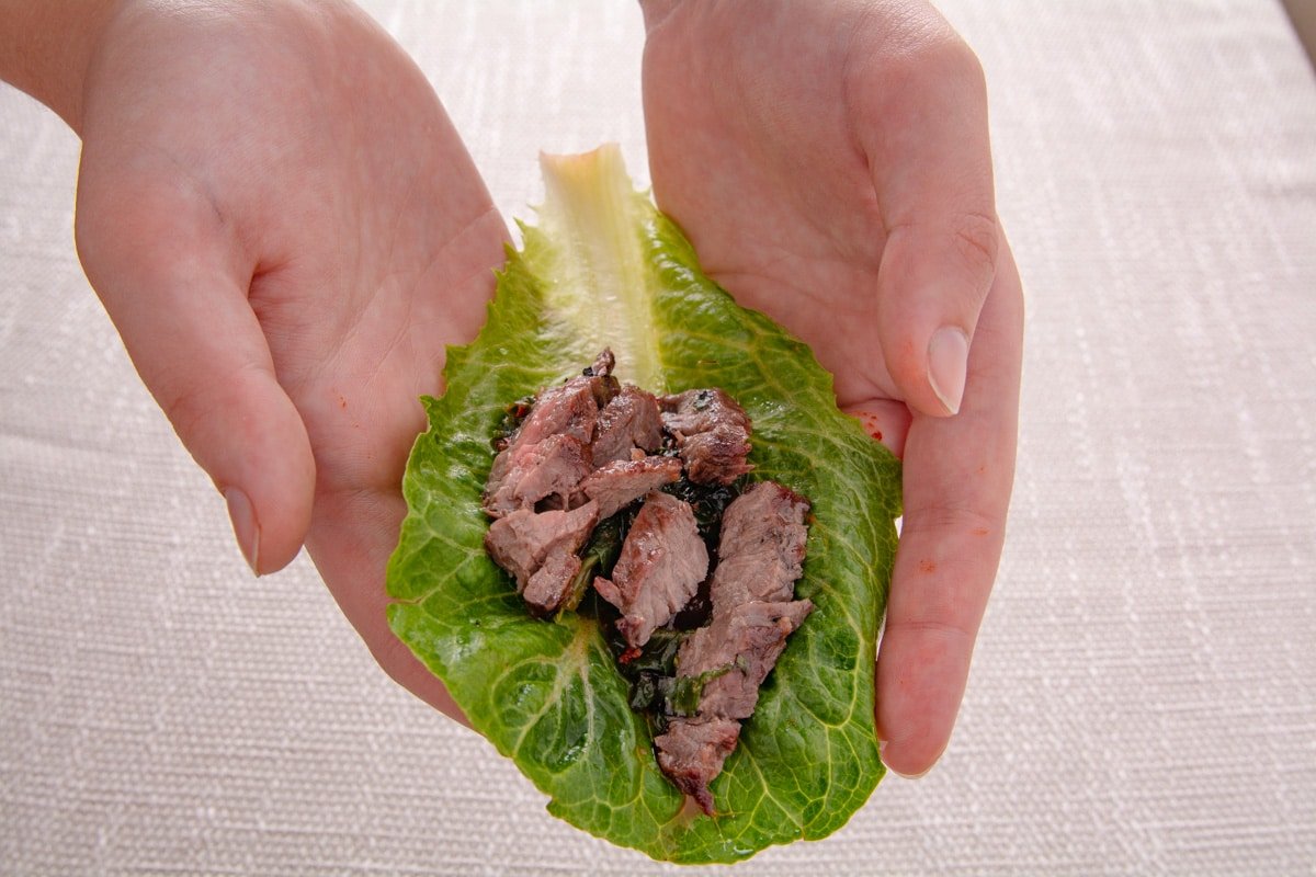 Grilled beef on a lettuce leaf