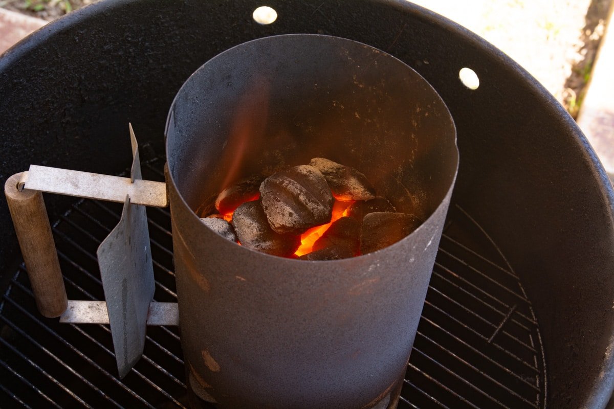 Charcoal with fire in a charcoal chimney.