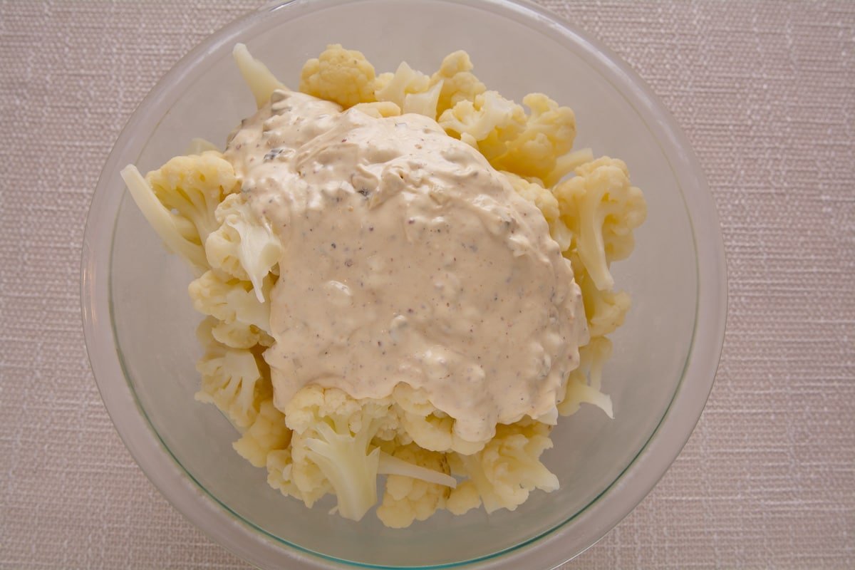Steamed cauliflower with dressing on a bowl