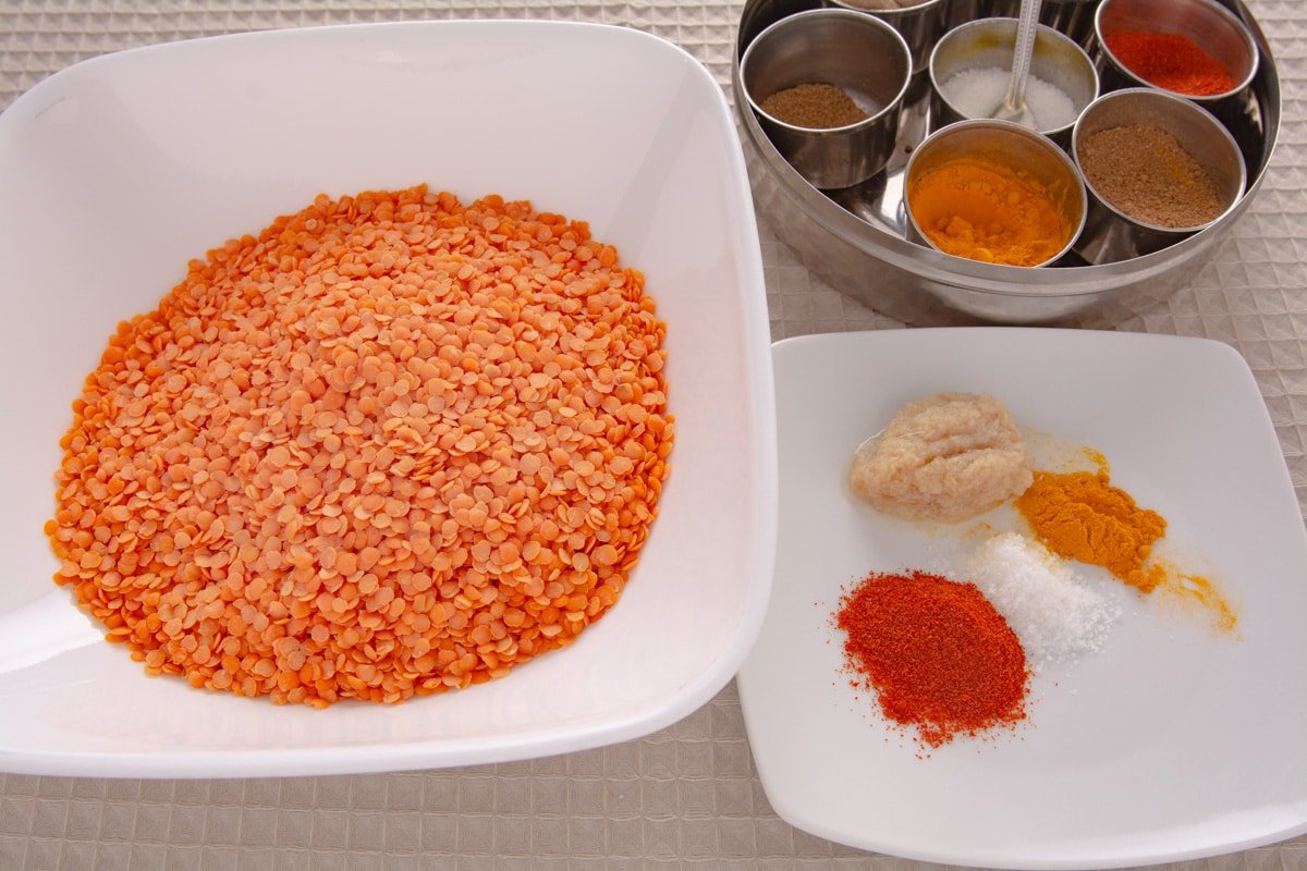 Lentils and spices on a table.