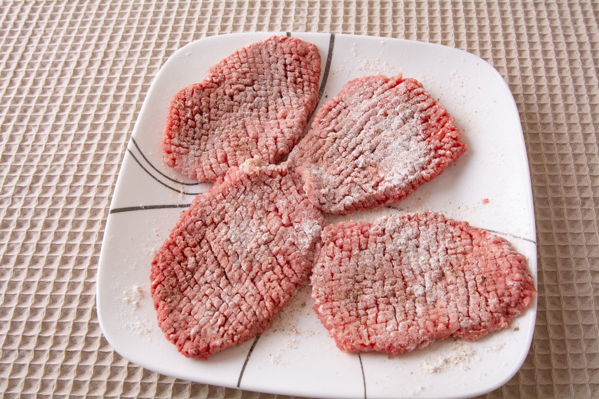 Seasoned cube steaks dusted with flour