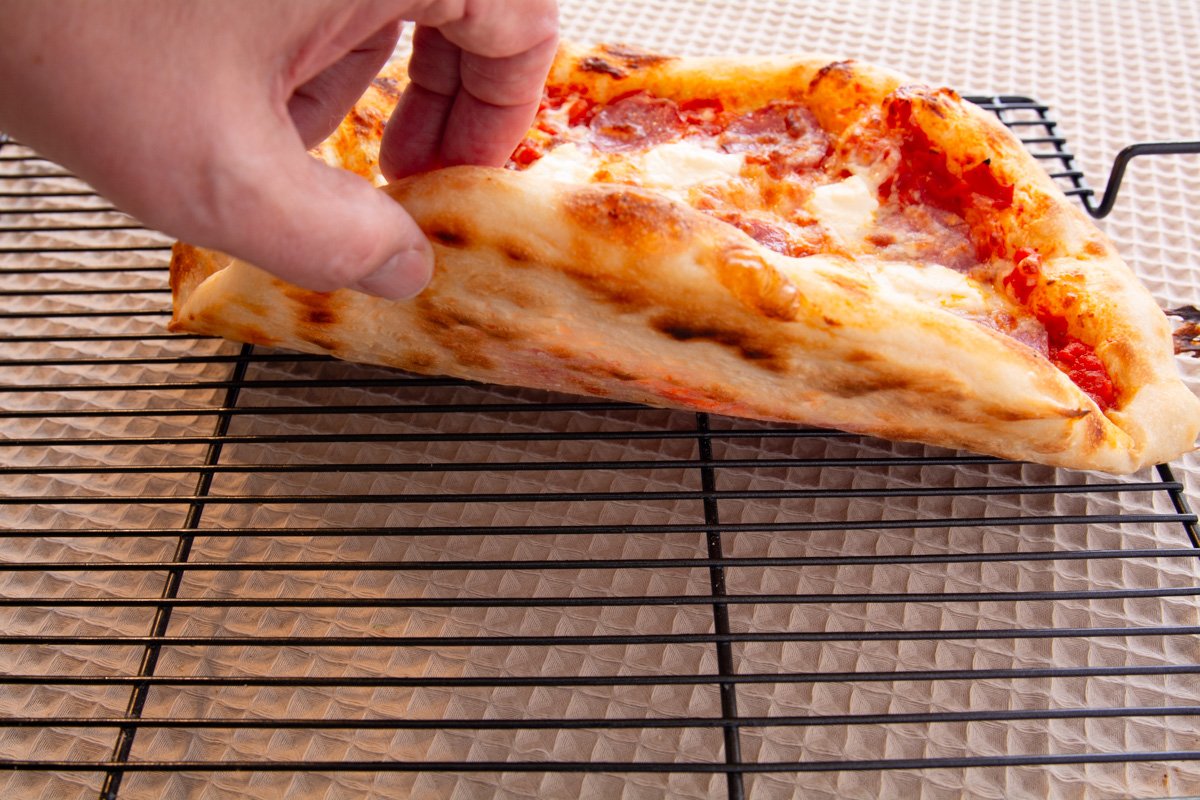 Showing the spots of the bottom of a pizza.