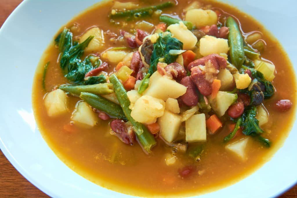 Comforting soup safe for gout / and vegans. This delicious soup is loaded with fresh vegetables and red beans for protein. #soup #veganrecipe #gout