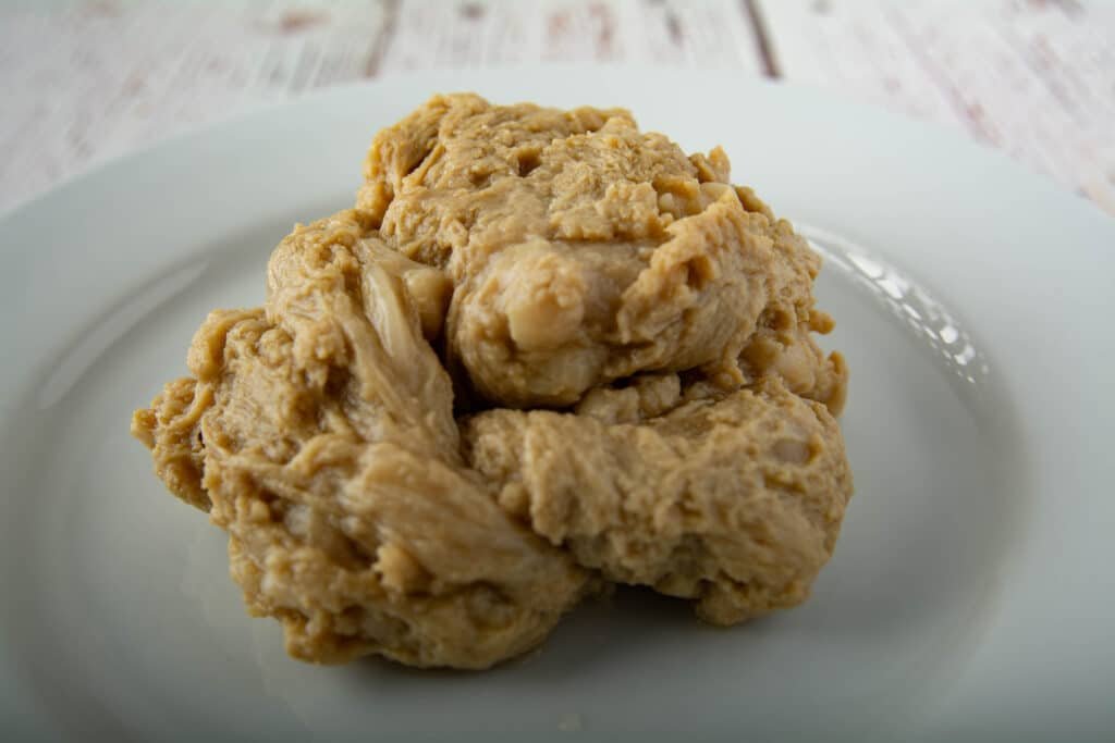 Cooked seitan on a plate, it kind of looks like a brain