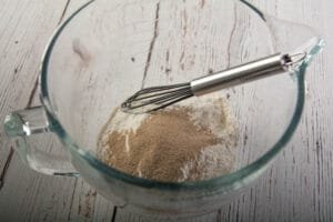 Dry ingredients is a glass bowl with whisk