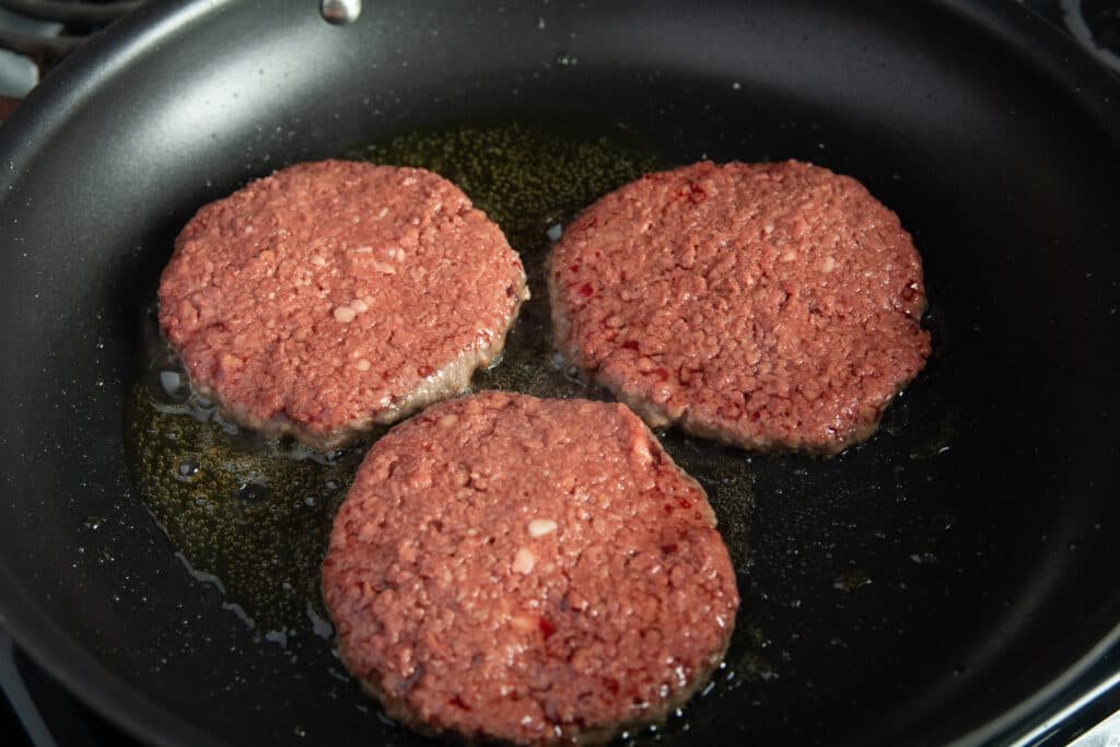 Burger patties in a pan