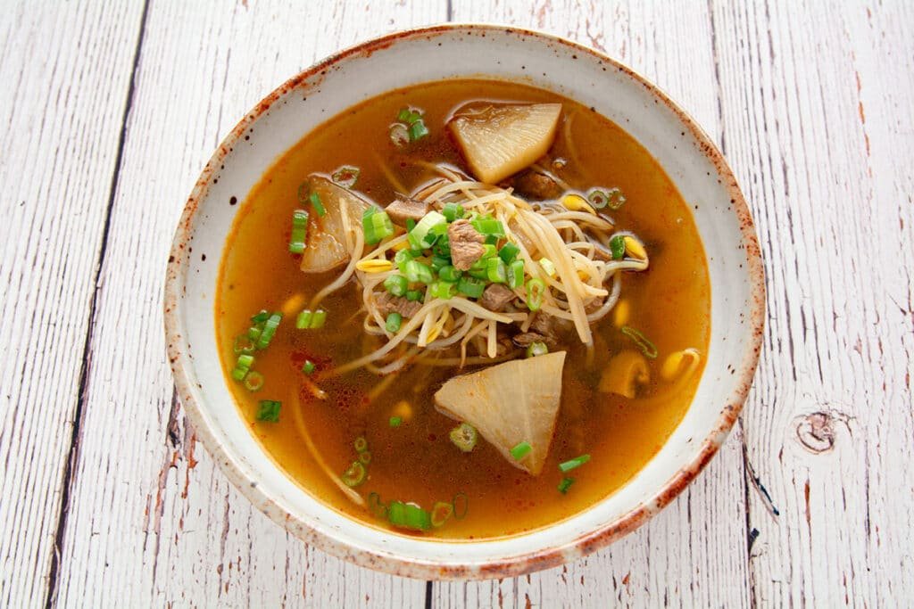 Photo of beef and radish soup in a bowl.