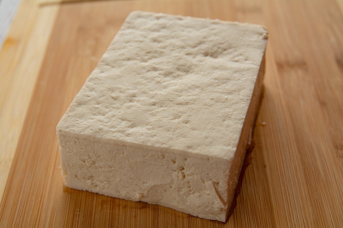 Block of tofu on a cutting board