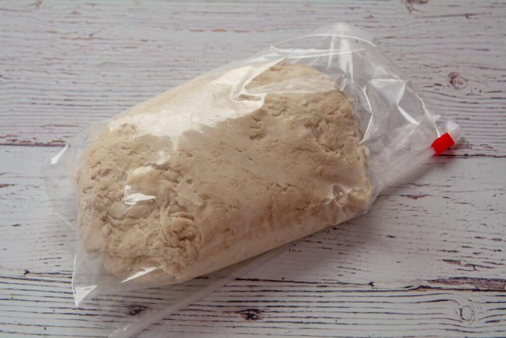 A batch of dough in a plastic bag