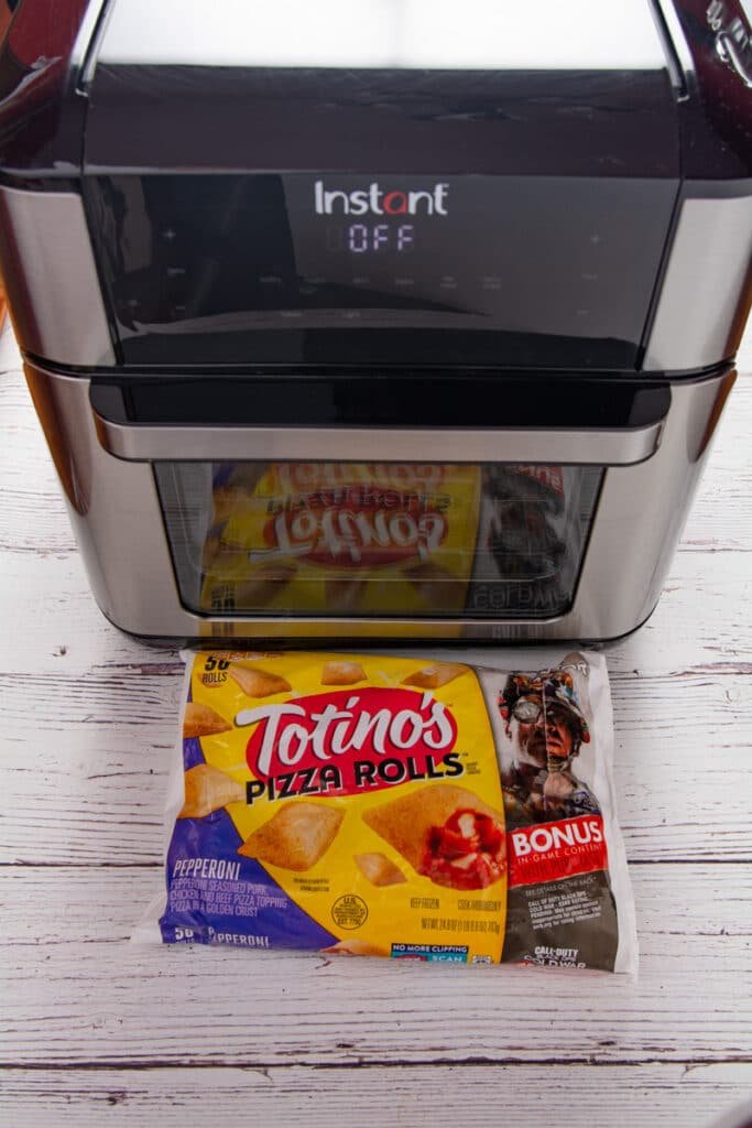 Bag of pizza rolls in front of an air fryer