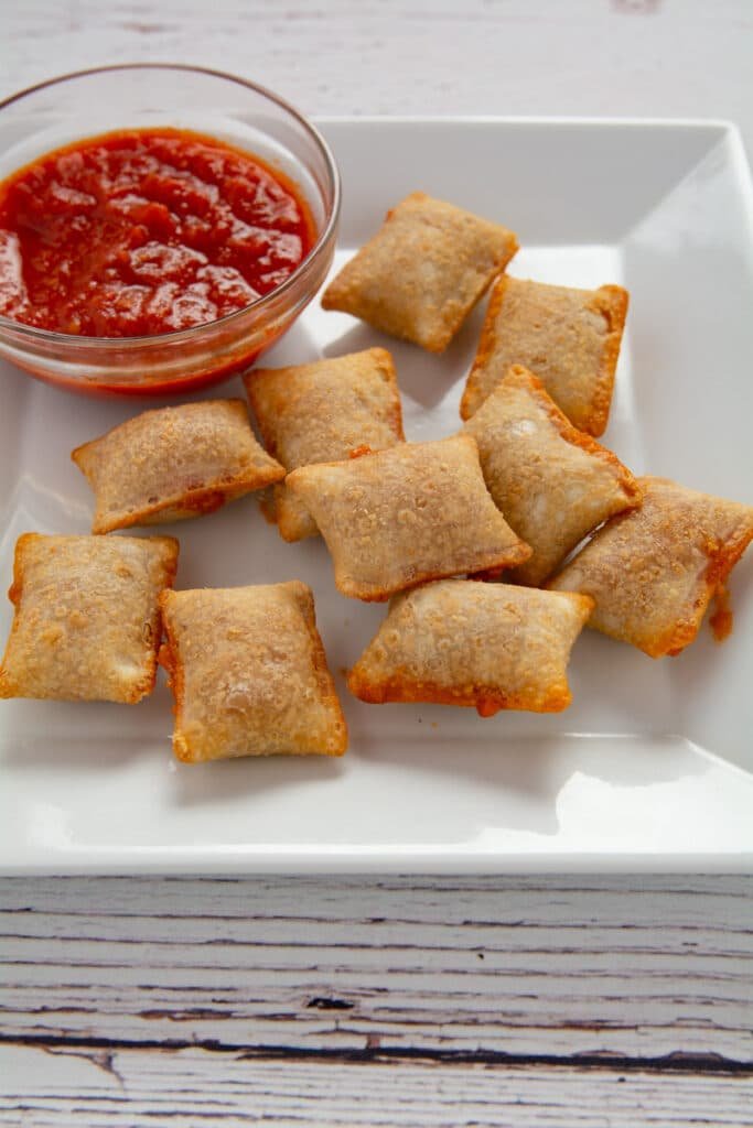 Air fried pizza rolls a few with sauce dripping out