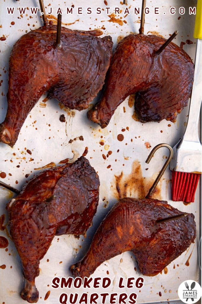 Finished smoked leg quarters on a sheet pan. this is a pin for pinterest