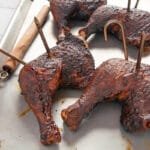 Finished smoked leg quarters on a sheet pan