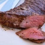 Cooked trip tip that has been sliced. The tri tip is medium rare.