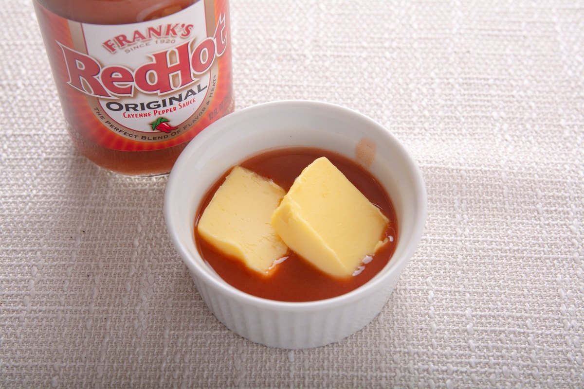 Hot sauce and butter in a ramikin