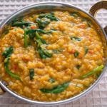 Finished dish of dal palak in a serving dish.