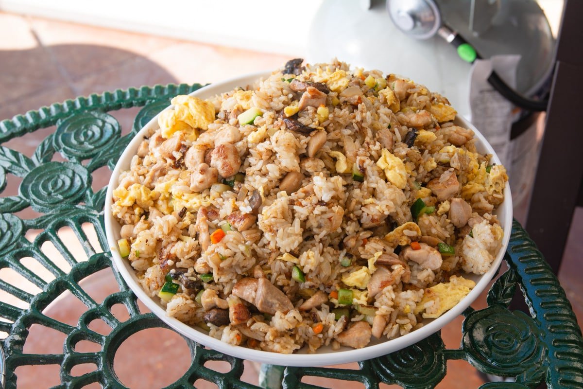 Chicken and veggie fried rice in a bowl.