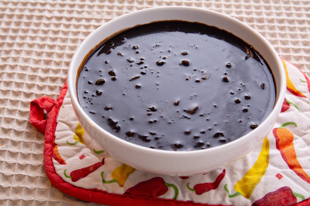 A bowl of leftover roux on a table.