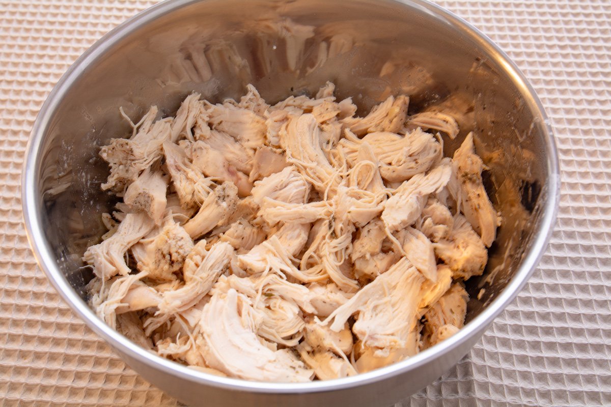 Bowl of cooked and shredded chicken