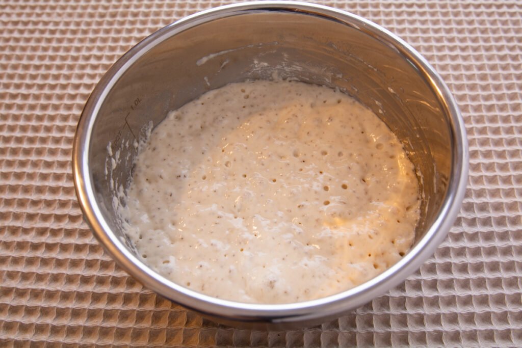 Poolish in a bowl showing lots of bubbles